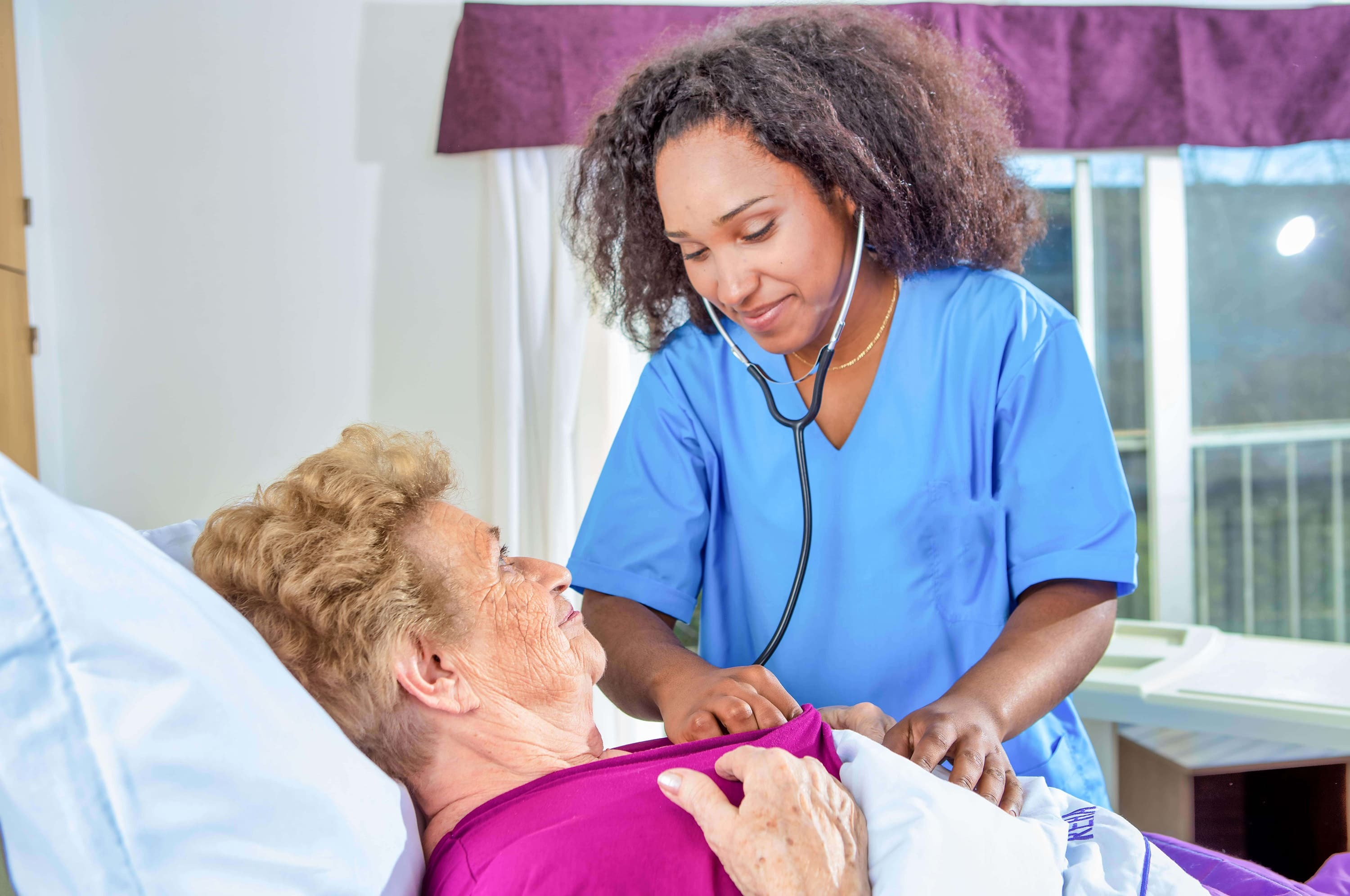 nurse caring for an elderly woman